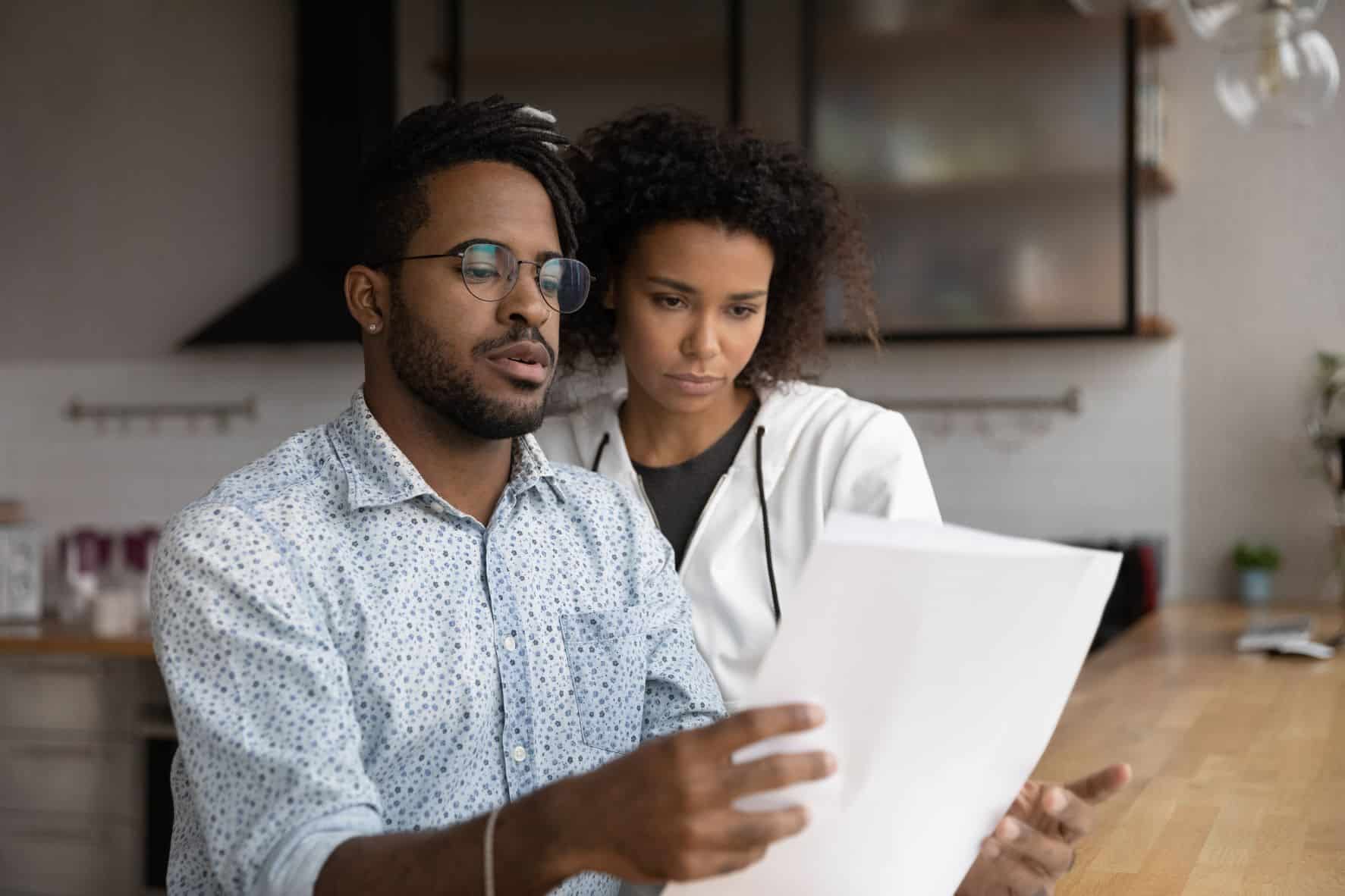 Two people looking at paperwork.