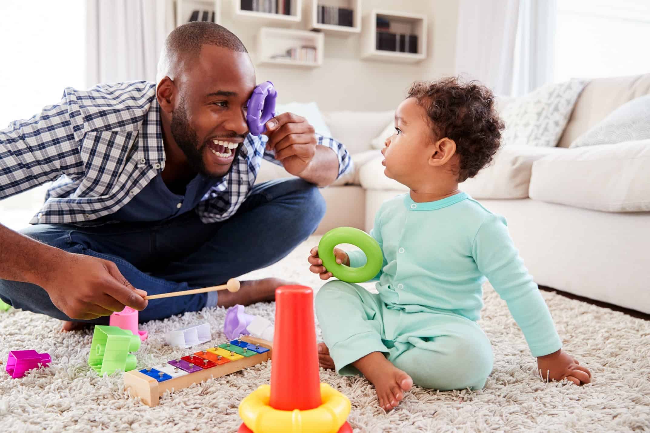 A father and kid playing with toys