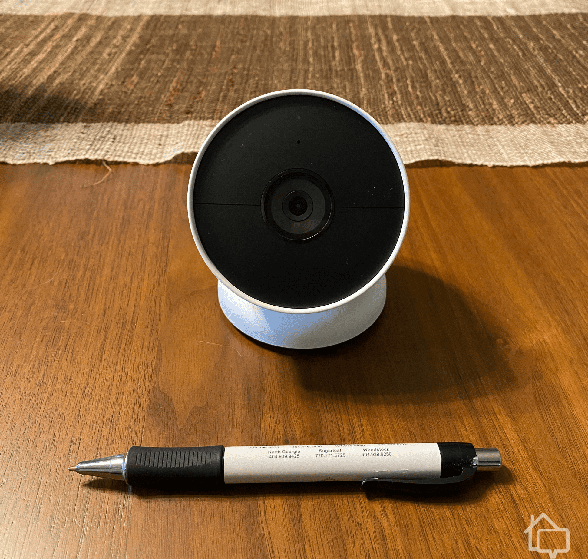 Google Nest Cam. Pen for Scale