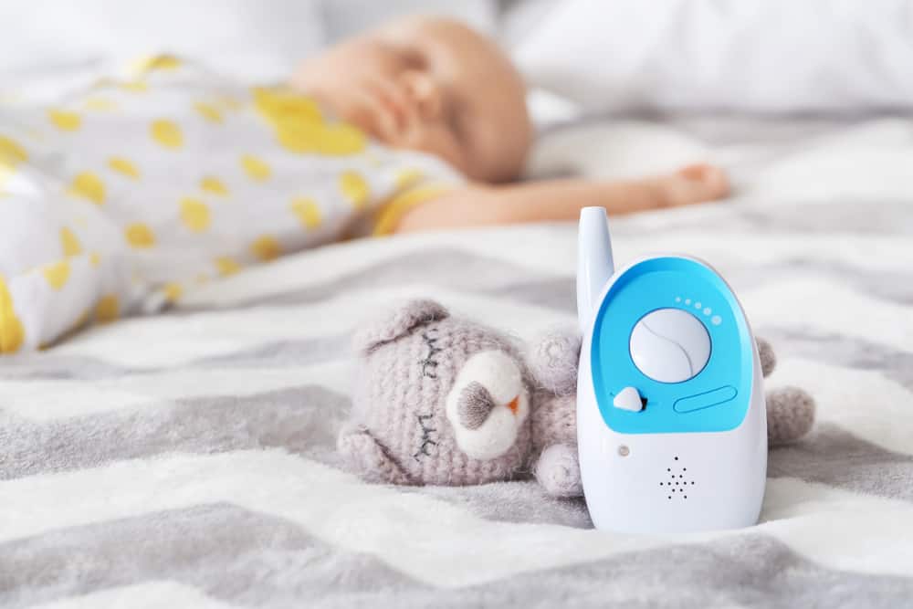 Baby monitor next to a baby