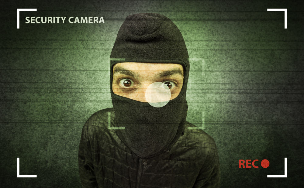 Burglar looking into a camera