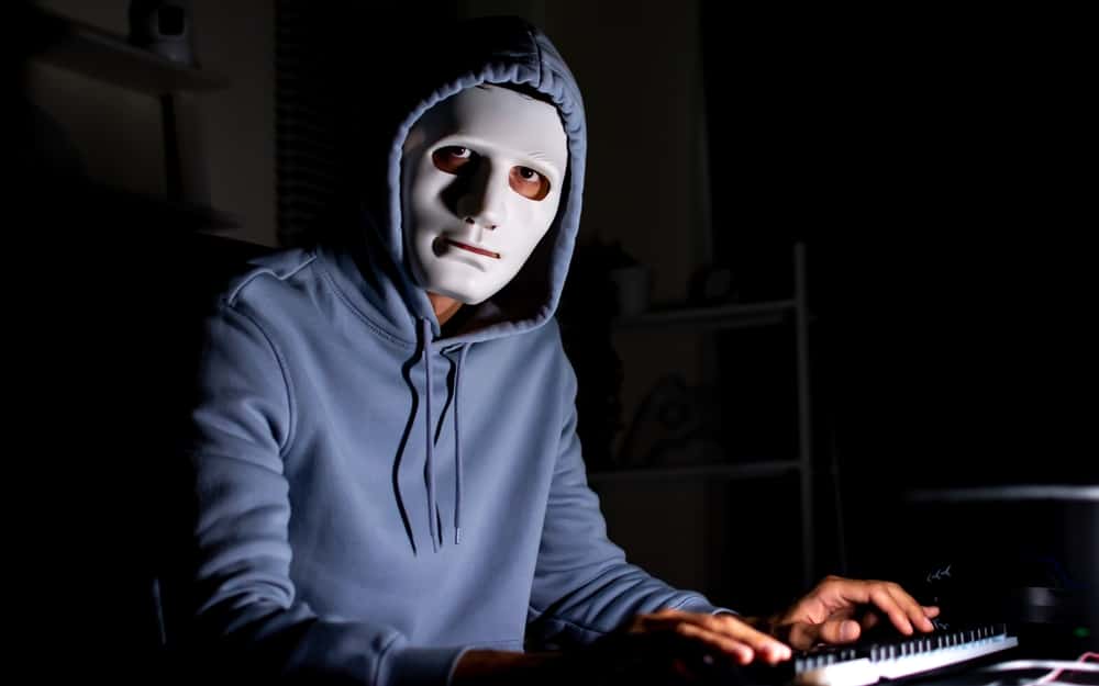 A hacker wearing a mask