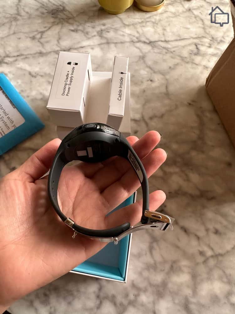 Holding the Bay Alarm Medical smartwatch