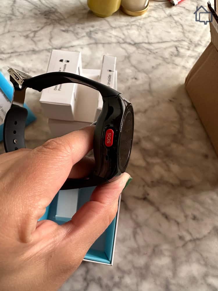 Holding the Bay Alarm Medical smartwatch