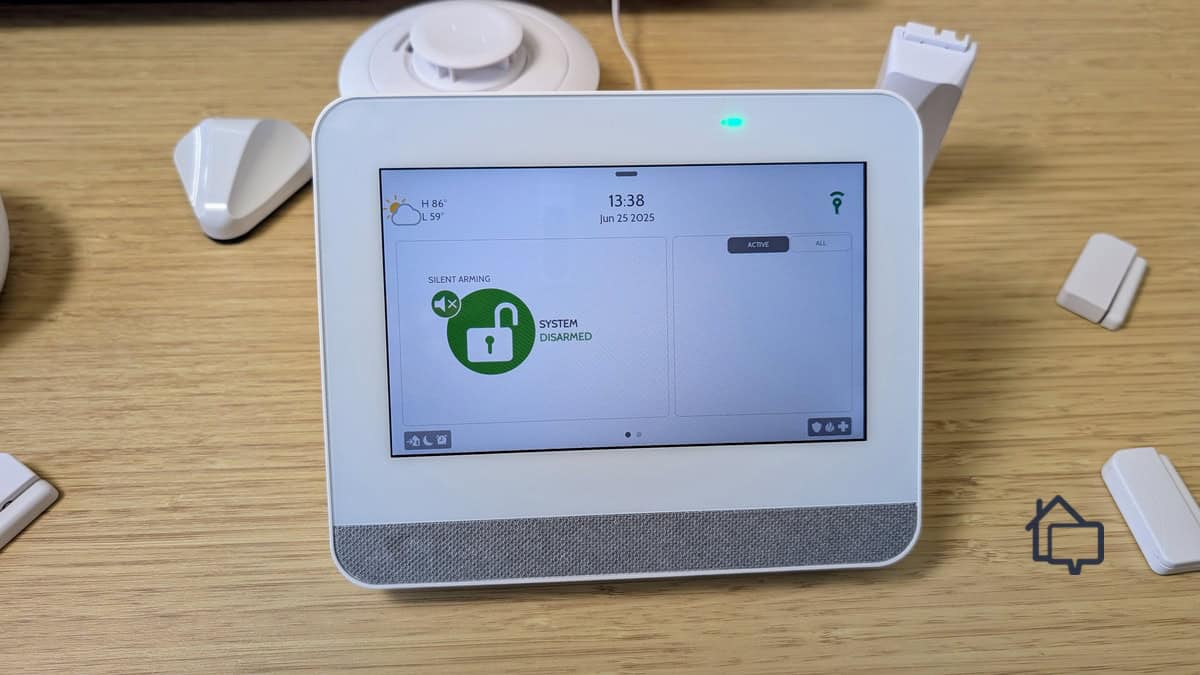 Our Frontpoint touch screen keypad next to some of the sensors it monitors and controls